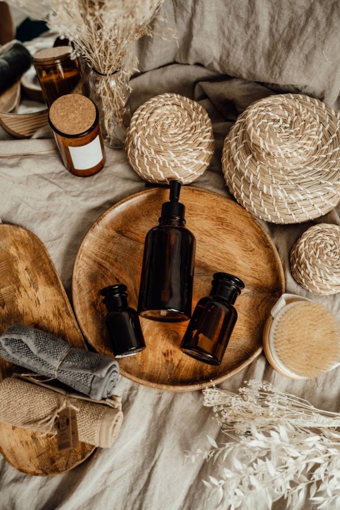 Eco-friendly skincare display with brown bottles on a rustic setup.